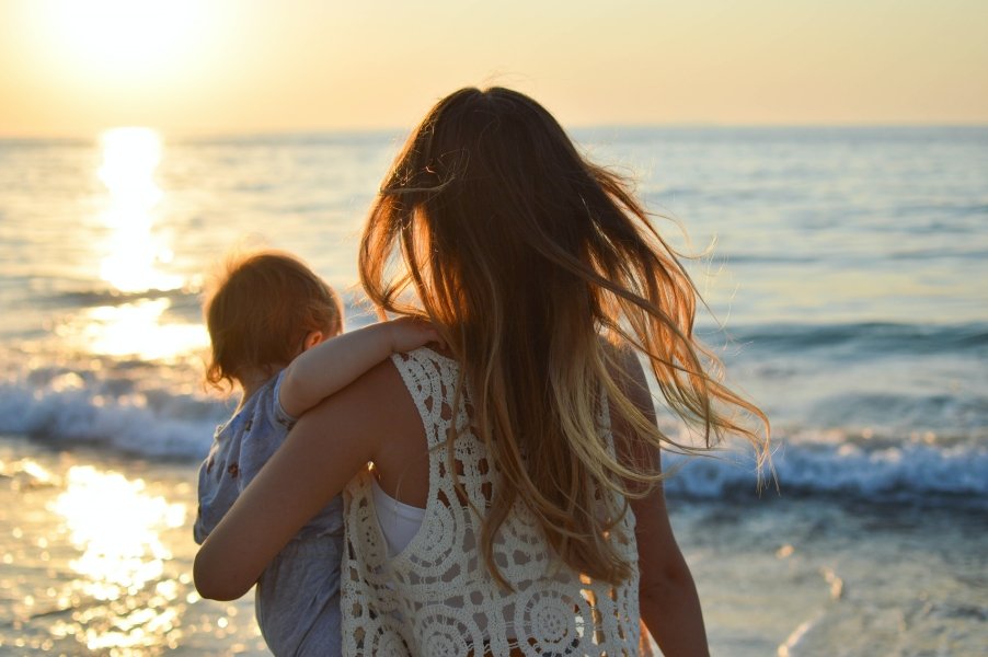 Family on beach in Corfu, Greece