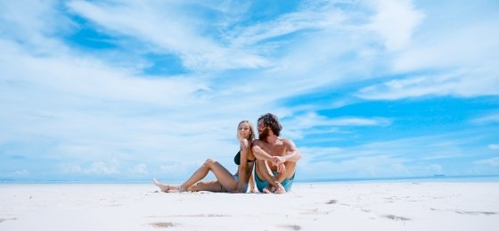 Couple sitting on beach